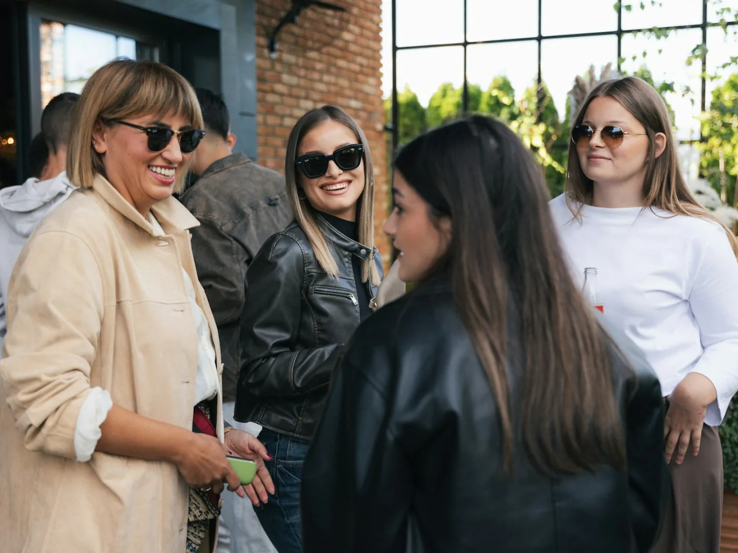 Friends sharing a relaxed conversation at a social gathering